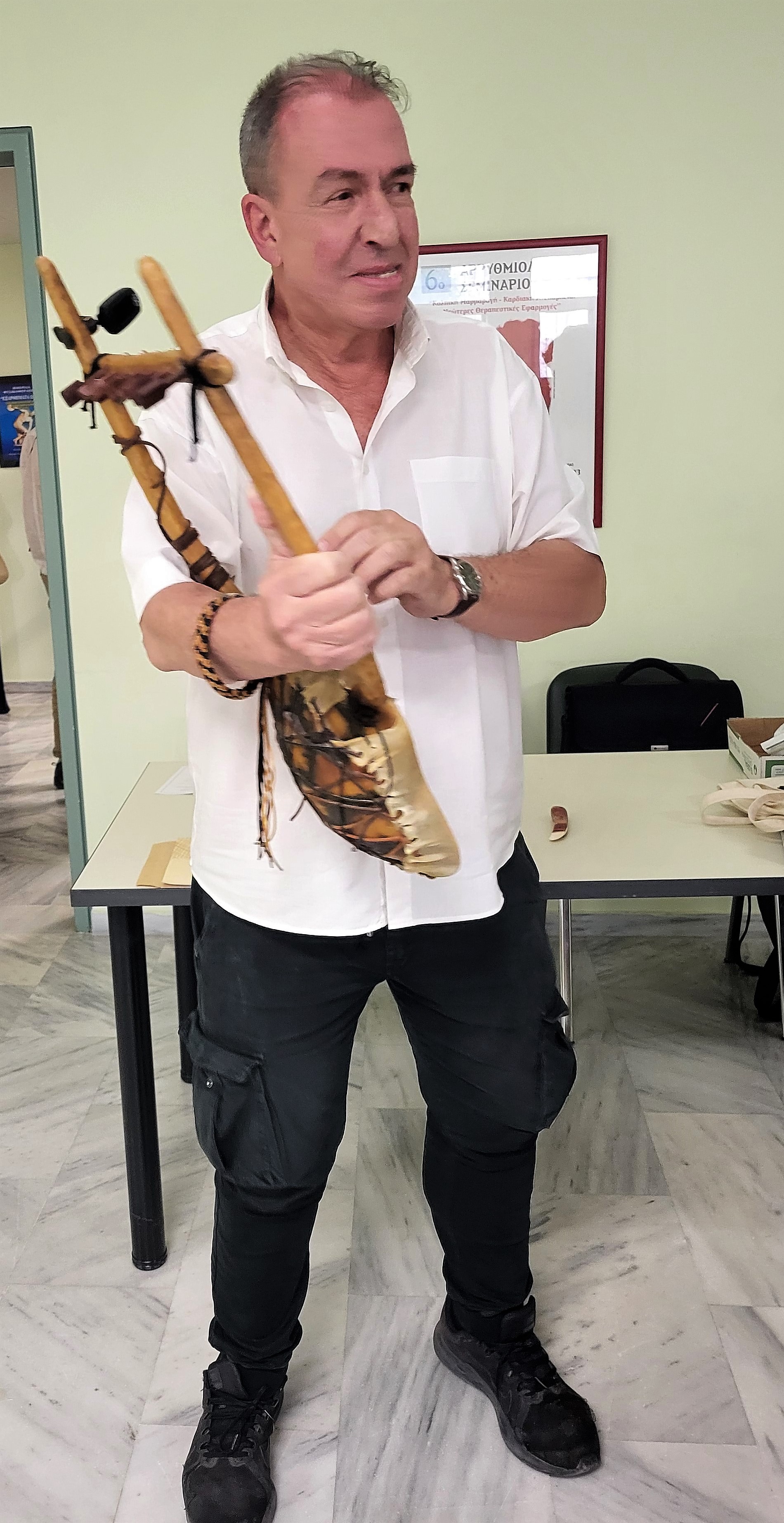 Menelaos Christopoulous holding a lyre